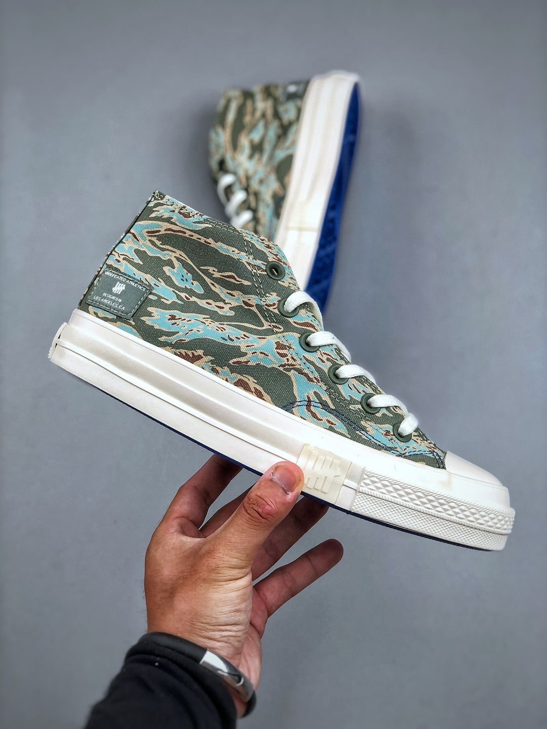 Convers! X Undefeated Chuck 70 Mid Sneakers