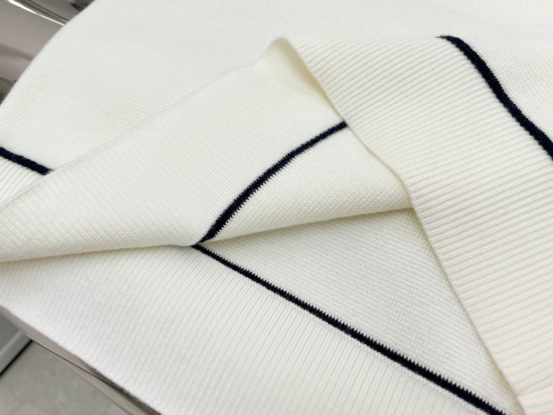 GU one-shoulder sweater